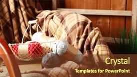 Presentation with yarn - Presentation theme consisting of rocking chair with plaid and yarn for knitting near wooden wall background and a tawny brown colored foreground