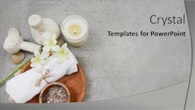 Presentation with spa concept stone - Colorful presentation design enhanced with rolled towels and salt in wooden bowl candles stone and white orchid flowers herbal ball on grey background spa concept place for text backdrop and a light gray colored foreground