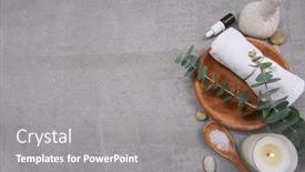  Presentation with eucalyptus leaves - Slide set with rolled towels in bowl in wooden bowl eucalyptus leaves stone and essential oils candle salt in spoon herbal ball on grey background place for text background and a gray colored foreground