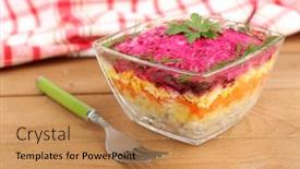  Presentation with russian - Audience pleasing theme consisting of russian herring salad in glass bowl on wooden table background backdrop and a coral colored foreground