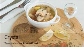  Presentation with vodka - PPT theme consisting of russian traditional fish soup - ukha served with bread lemon tomato and vodka background and a gold colored foreground