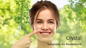 Presentation with rhinoplasty - PPT layouts with beauty people and rhinoplasty concept - beautiful young woman pointing to her nose over green natural background background and a soft green colored foreground