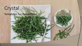  Presentation with coastal - Presentation theme consisting of samphire coastal vegetable on a white plate and bowl with silver fork over oak wood background background and a soft green colored foreground