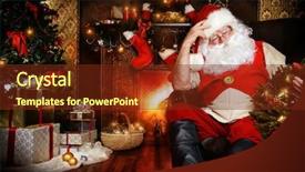  Presentation with gifts - Amazing PPT theme having santa claus sitting at home with gifts dressed in his home clothes christmas decoration backdrop and a tawny brown colored foreground