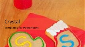  Presentation with table napkin - Slide deck consisting of santa's colorful cookies on red napkin on a wooden table with a candle background and a gold colored foreground