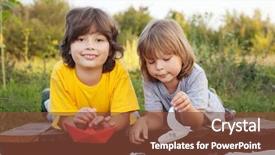  Presentation with closeup of a paper boat - Presentation having sea games symbol - two boys allowed paper boats background and a tawny brown colored foreground