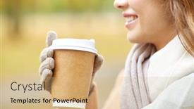  Presentation with tea coffee - Presentation theme enhanced with season hot drinks advertisement and people concept - close up of beautiful happy young woman drinking coffee or tea from disposable paper cup in autumn park background and a coral colored foreground