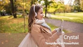  Presentation with computer music - PPT layouts with season technology and people concept - beautiful happy young woman with tablet pc computer and headphones listening to music and sitting on bench in autumn park background and a coral colored foreground
