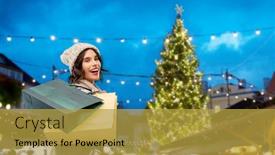  Presentation with consumerism - PPT theme enhanced with seasonal sale and consumerism concept - happy smiling young woman in knitted winter hat and sweater with shopping bags over christmas tree at old town square market in tallinn estonia background background and a gold colored foreground