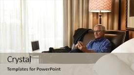  Presentation with bed hotel - Slide deck with senior businessman seated on hotel room armchair using his cell phone horizontal format with the bed in the foreground background and a light gray colored foreground