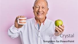  Presentation with green apple - Audience pleasing PPT theme consisting of senior-caucasian-man-holding-denture backdrop and a lemonade colored foreground