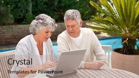  Presentation with laptop - PPT theme consisting of senior citizens computer - retired couple working on their background and a coral colored foreground