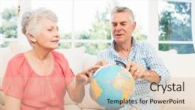  Presentation with globe award - PPT theme with senior couple looking at globe background and a lemonade colored foreground