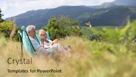  Presentation with chairs - Presentation theme having senior couple relaxing in folding chairs in countryside background and a yellow colored foreground