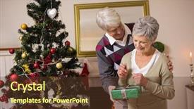  Presentation with senior living - PPT theme enhanced with senior couple swapping gifts background and a tawny brown colored foreground