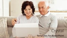  Presentation with tehnology - PPT theme having senior-couple-using-laptop-computer background and a coral colored foreground