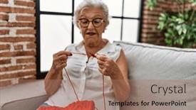  Presentation with sewing needle - Presentation theme enhanced with senior-grey-haired-woman-sewing background and a coral colored foreground