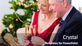  Presentation with sparkling wine - Audience pleasing PPT layouts consisting of senior man and woman celebrating christmas eve with a glass of sparkling wine backdrop and a wine colored foreground