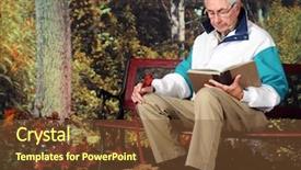  Presentation with poodle - Cool new slide set with senior man reading a book on a park bench in the fall his pet poodle resting at his feet backdrop and a tawny brown colored foreground