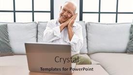  Presentation with laptop - Theme enhanced with senior-man-using-laptop background and a coral colored foreground