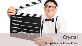  Presentation with clapper - PPT layouts having senior movie director holding a movie clapper smiling and looking at the camera isolated on white background background and a soft green colored foreground