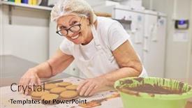  Presentation with chocolate biscuits - Presentation design with senior-woman-baker-with-experience background and a coral colored foreground