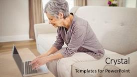  Presentation with senior living - Amazing PPT theme having senior woman sitting on sofa and using laptop in living room backdrop and a mint green colored foreground