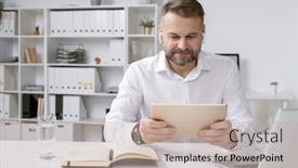  Presentation with video training - PPT layouts having serious-businessman-with-touchpad-watching background and a mint green colored foreground