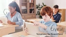  Presentation with classmates - Amazing PPT theme having serious-schoolboy-with-touchpad-looking backdrop and a lemonade colored foreground