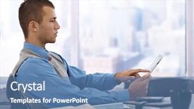  Presentation with skyscraper - Cool new PPT theme with serious young businessman sitting at skyscraper office desk using tablet computer backdrop and a teal colored foreground