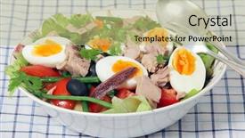  Presentation with tuna - Audience pleasing slides consisting of serving bowl with spoon and fork of traditional nicoise salad - lettuce potato tomato green beans tuna anchovies boiled eggs capers and black olives garnished with flat-leaf parsley backdrop and a mint green colored foreground