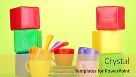  Presentation with light green - Presentation theme having set of children's dishes and cubes on light green background background and a yellow colored foreground