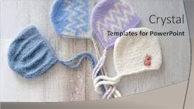  Presentation with newborn - PPT theme having set-of-tender-knitted-hats background and a light blue colored foreground