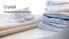  Presentation with newborn baby - Beautiful presentation theme featuring set up - clothing babyhood motherhood and object backdrop and a white colored foreground