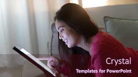  Presentation with computer room - Theme enhanced with side view close up of a young caucasian woman smiling and using a tablet computer lying on the sofa in her sitting room in the evening background and a wine colored foreground