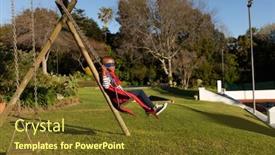 Presentation with superhero - Colorful presentation theme enhanced with side view of a pre teen mixed race boy dressed in a superhero costume with a red cape and a blue mask in a garden swinging in a playground backdrop and a tawny brown colored foreground