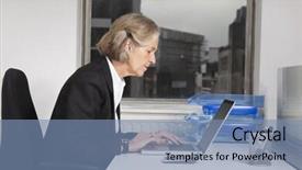  Presentation with desk - Audience pleasing PPT theme consisting of side view of senior businesswoman using laptop at desk in office backdrop and a seafoam green colored foreground
