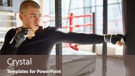  Presentation with boxing fight - Theme with side view portrait of young muscular sports man hitting punching bag during boxing practice in fight club training speed and strength background and a tawny brown colored foreground