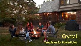  Presentation with teenagers - PPT theme consisting of sit talking around a fire background and a tawny brown colored foreground