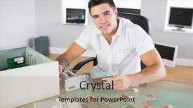  Presentation with hardware computer - PPT theme with sitting at desk holding hardware background and a coral colored foreground