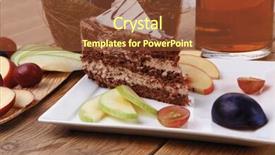  Presentation with table grape - Colorful theme enhanced with slice of chocolate cream brownie cake topped with white chocolate and cream flowers with hot tea mug decorated with fruits apple plum and grape on plate on wooden table backdrop and a tawny brown colored foreground