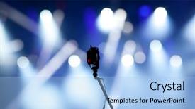  Presentation with stage lights - Theme having small camera and stage lights background and a light blue colored foreground