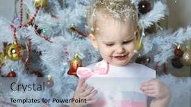  Presentation with child tree - Beautiful presentation theme featuring small child in a beautiful dress stands near a christmas tree and tries to catch snowflakes in the open mouth backdrop and a light blue colored foreground