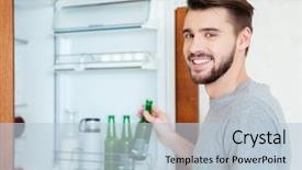  Presentation with refrigerator - Amazing PPT theme having smiling attractive young man taking bottle of beer from refrigerator on the kitchen backdrop and a lemonade colored foreground