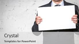  Presentation with paint white brick wall - PPT theme consisting of smiling businessman holding blank placard background and a light gray colored foreground