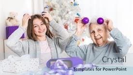  Presentation with grandma - Audience pleasing slide set consisting of smiling granddaughter ang grandma playing with decorative balls at christmas backdrop and a light blue colored foreground