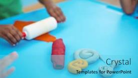 Presentation with clay - PPT layouts having smiling kids using modelling clay at their desk background and a light blue colored foreground