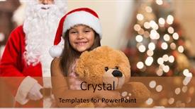 Presentation with girl christmas - Colorful presentation theme enhanced with smiling little girl wearing a christmas hat holding a teddy bear santa claus nad a christmas tree in the background backdrop and a red colored foreground