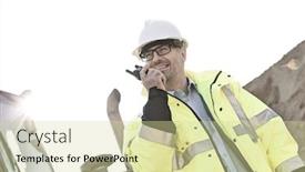  Presentation with walkie talkie - Slide deck enhanced with smiling supervisor using walkie-talkie at construction site against clear sky background and a soft green colored foreground
