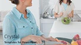  Presentation with tossing - PPT theme with smiling woman cutting carrots with her friend tossing salad in the kitchen and looking at each other background and a light blue colored foreground